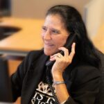 Sandra worker at Back Office Support smiling